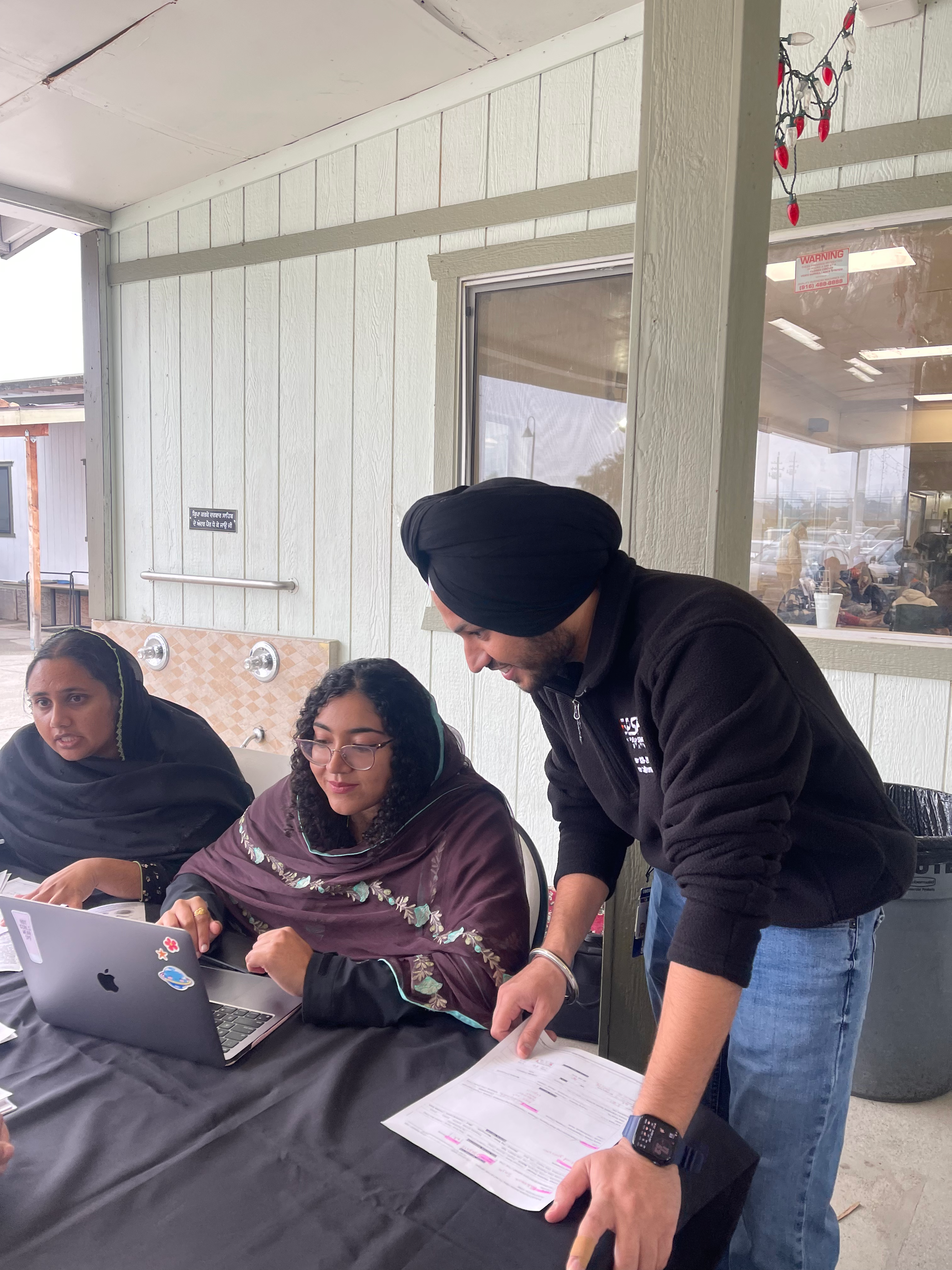 Volunteers working with community members
