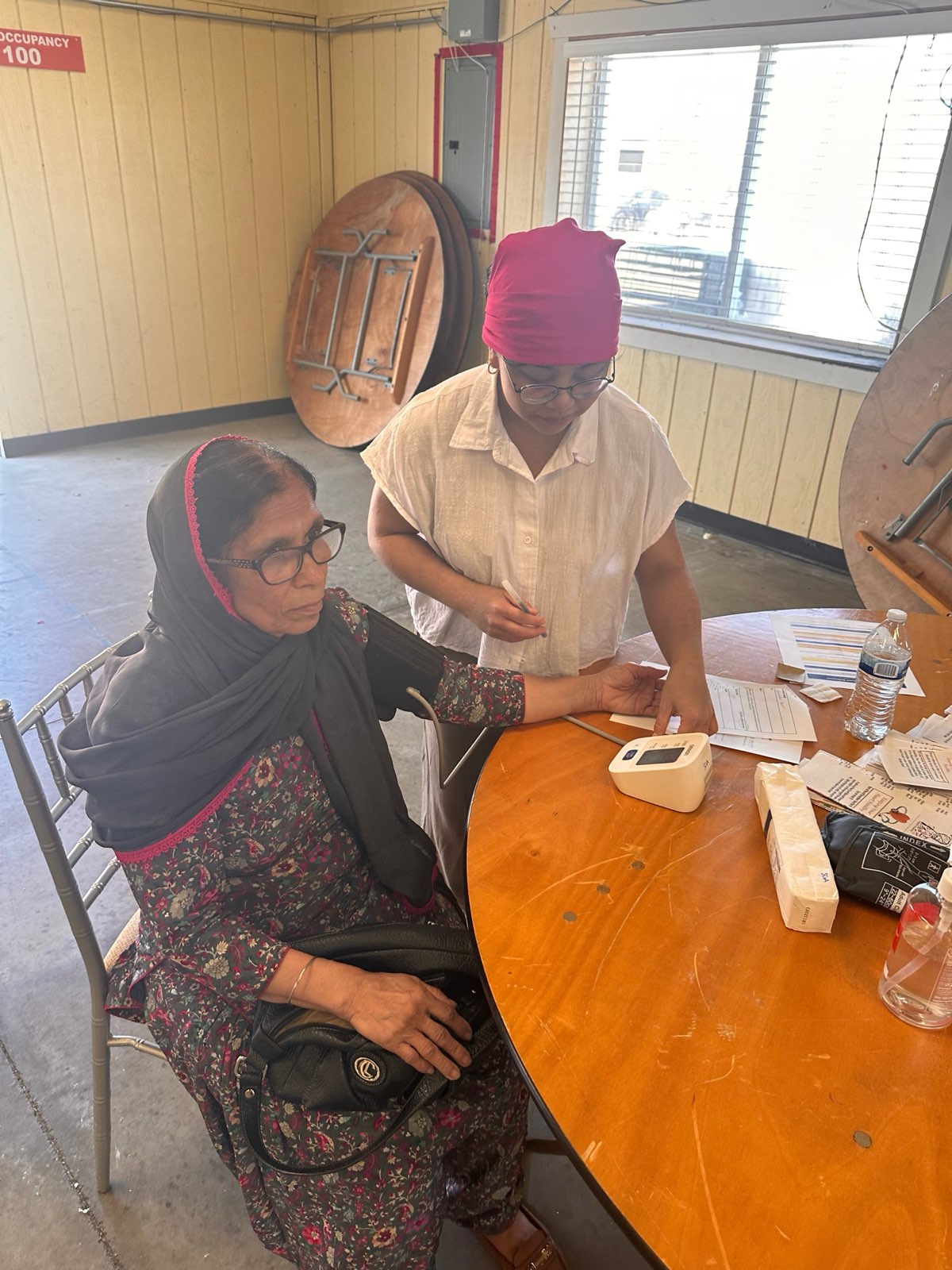 Volunteers checking blood pressure at the March screening