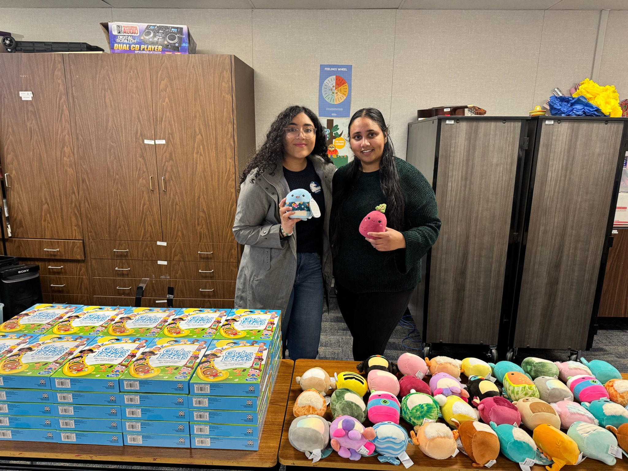 Volunteers organizing toys and gifts for students